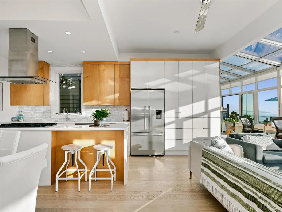 Renovated kitchen with island and gas range, 15068 Victoria Avenue